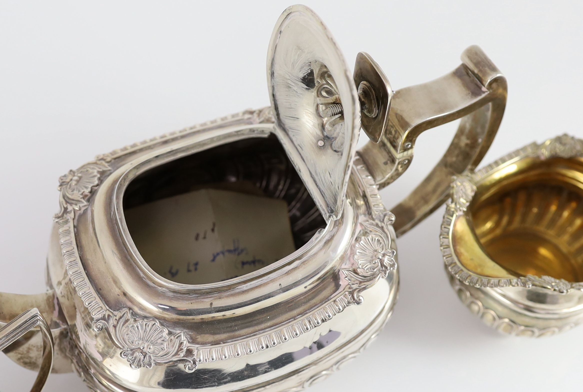 A George III Scottish silver demi-fluted three piece tea set by George Fenwick